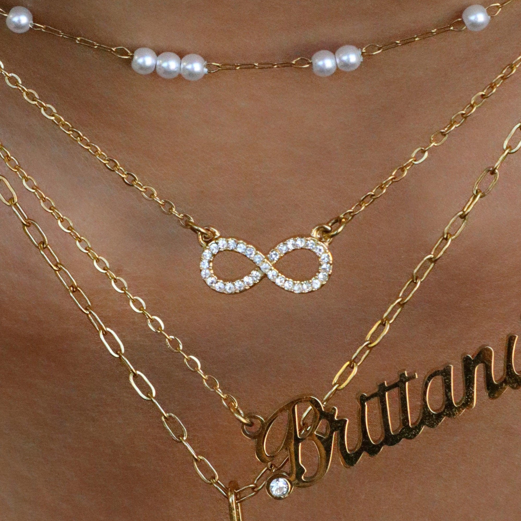 Infinity Necklace Meaning: What the ∞ Symbol Means & How to Wear It