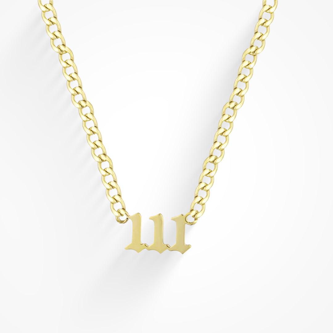 Gold tone curb chain necklace with a 111 angel number pendant in gothic style numerals