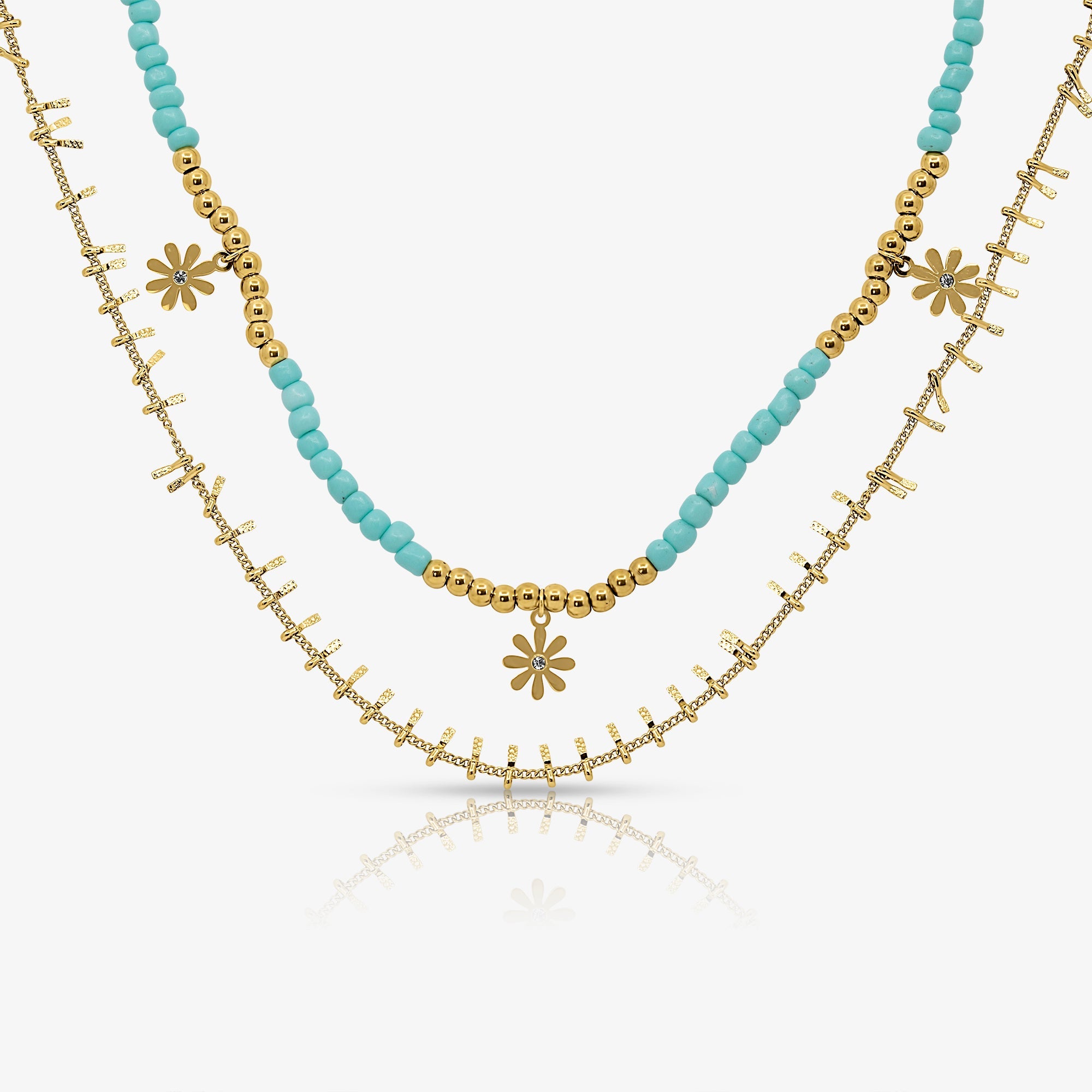 Two layered gold necklaces, one with turquoise blue beads and small daisy charms