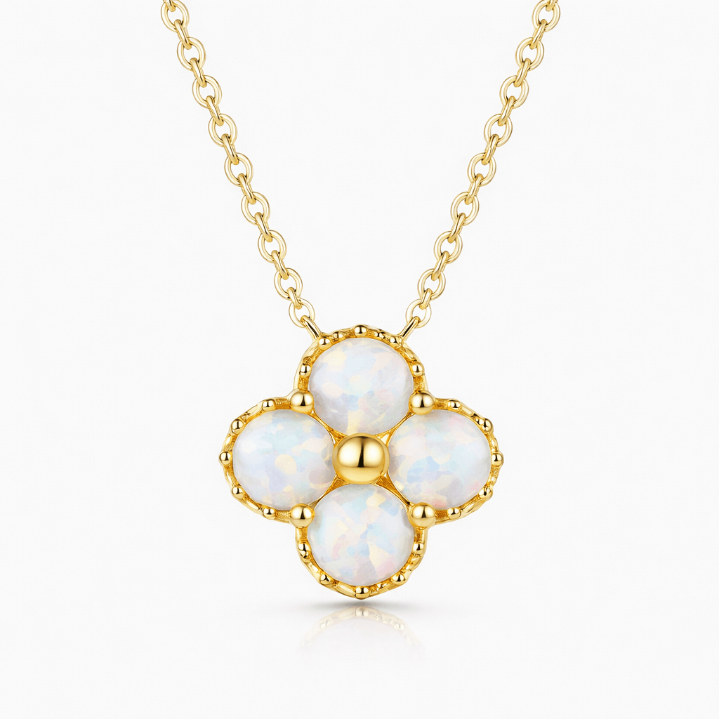Flower pendant necklace with four white opal stones on a gold chain