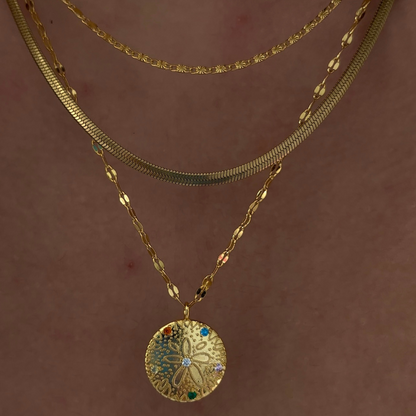 Collier en forme de dollar des sables